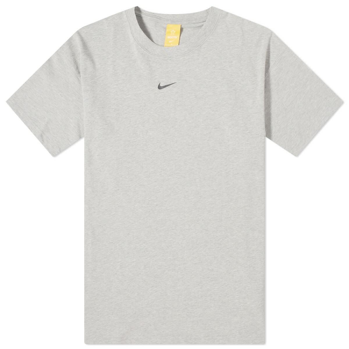 Photo: Nike x NOCTA Cardinal Stock T-shirt in Dark Grey Heather/Matte Silver/Black