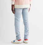 AMIRI - Distressed Stretch-Denim Jeans - Blue