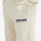 Sporty & Rich Men's Team Logo Sweat Pants in Cream/Navy
