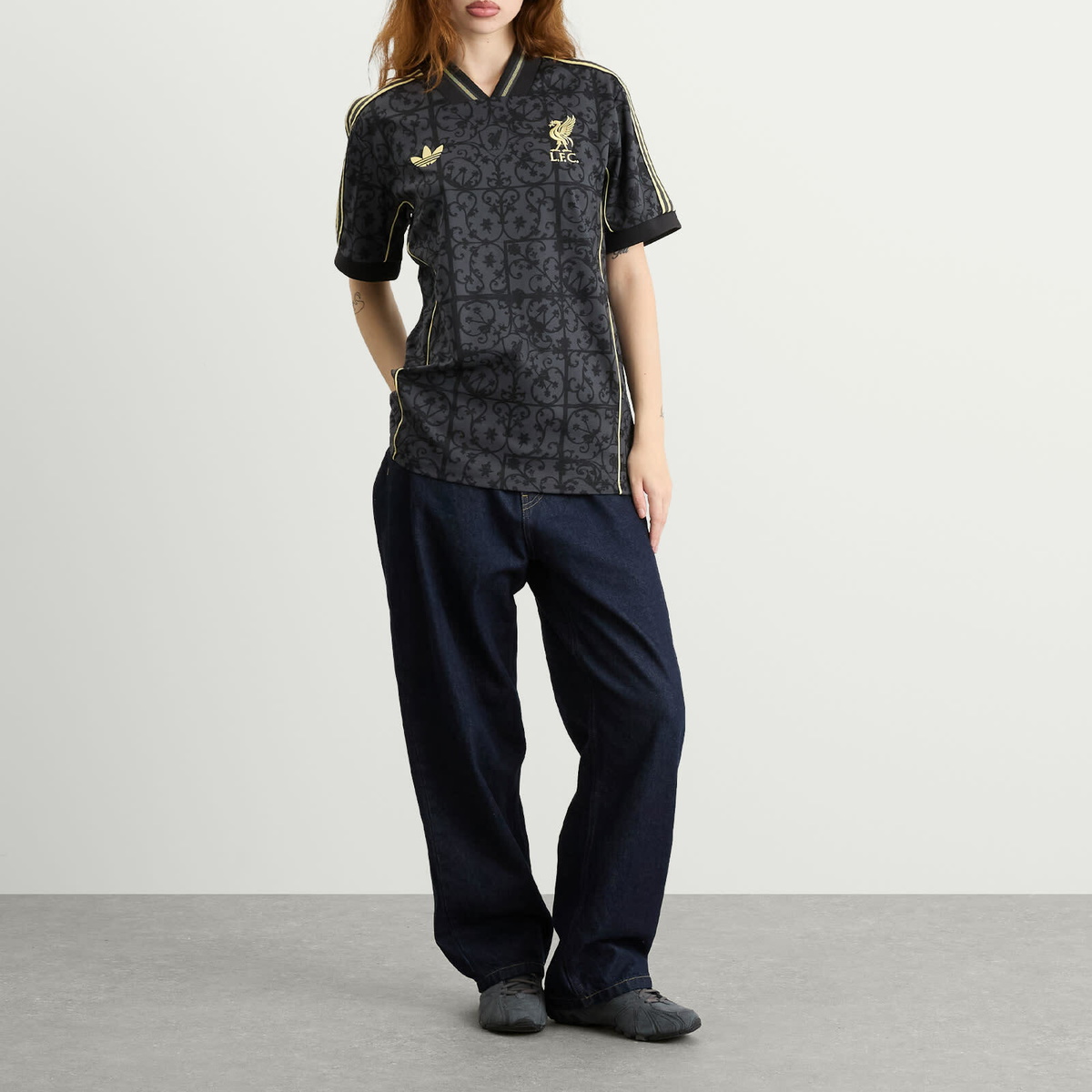 Adidas Liverpool FC. Lifestyler Jersey Top in Carbon/Halo Gold