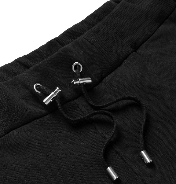 Photo: Balmain - Slim-Fit Tapered Logo-Embossed Loopback Cotton-Jersey Sweatpants - Black