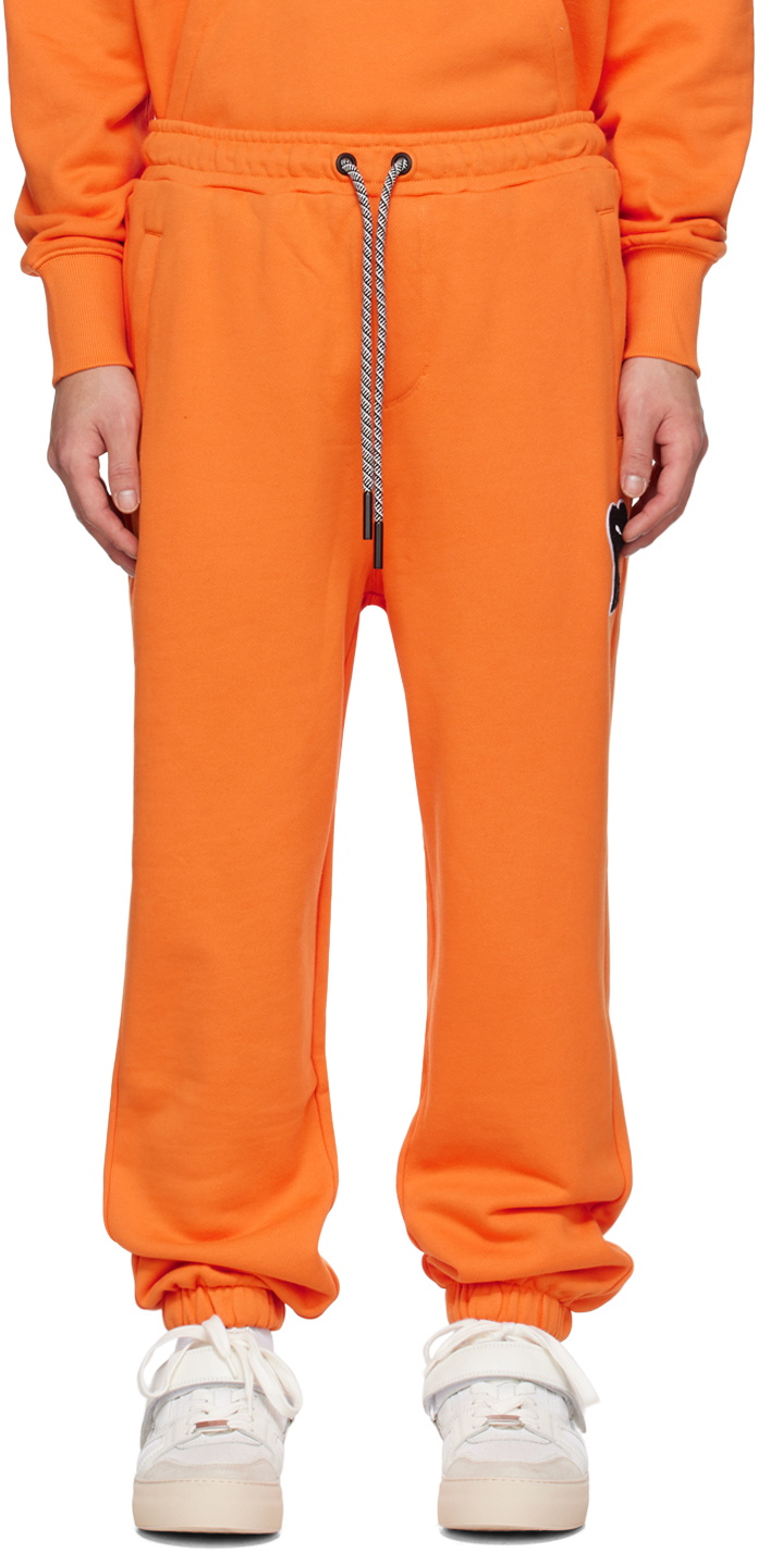 Orange puma sweatpants best sale