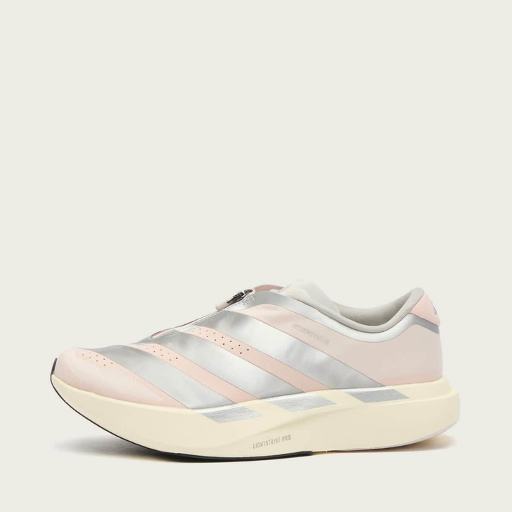 Photo: Adidas Women's x Naked CPH Adizero Evo SL Sneaker in Sandy Pink/Silver Met/Off White