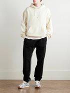 Givenchy - Tapered Logo-Appliquéd Cotton-Jersey Sweatpants - Black