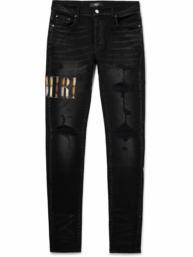 Photo: AMIRI - Skinny-Fit Appliquéd Distressed Jeans - Black