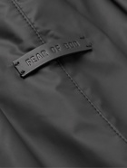 Fear of God - Tapered Logo-Appliquéd Rubber-Bonded Nylon Sweatpants - Black