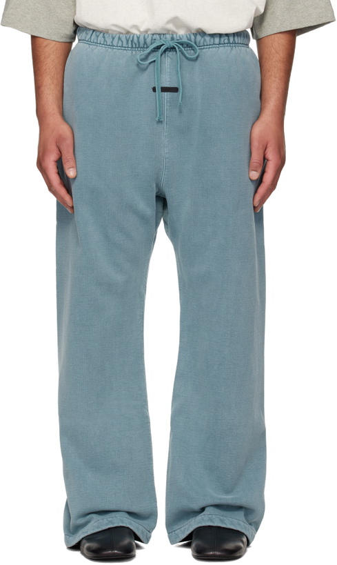 Photo: Fear of God ESSENTIALS Blue Signature Classic Flare Sweatpants