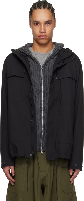 Photo: RAINS Black Suva Hardshell Cargo Rain Jacket