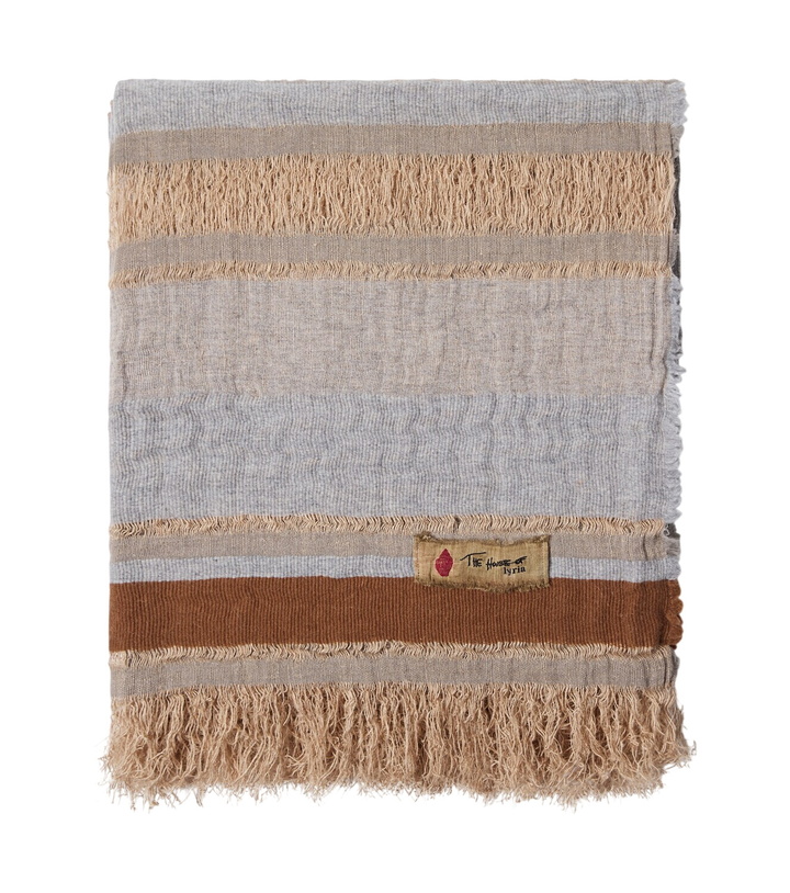 Photo: The House of Lyria Xoroi striped jute and wool-blend throw