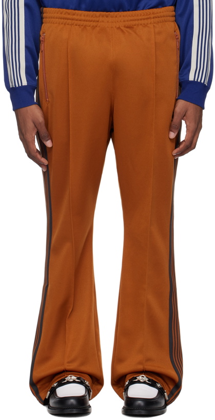 Photo: NEEDLES Orange Bootcut Track Pants