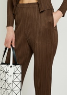 Pleats Please Issey Miyake Pleated Tapered-leg Woven Trousers Brown