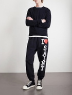 SAINT MXXXXXX - I Love Saint Tapered Printed Cotton-Jersey Sweatpants - Black