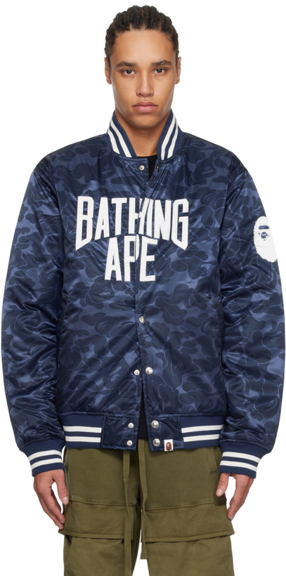 Photo: BAPE Navy Solid Camo NYC Logo Varsity Bomber Jacket