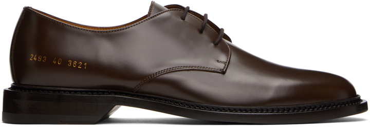 Photo: Common Projects Brown Polished Leather Derbys