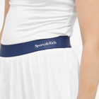Sporty & Rich Women's Serif Logo Pleated Skirt in White/Navy Navy