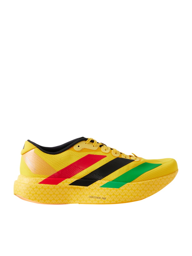 Photo: ADIDAS RUNNING - Jamaica Football Federation Adizero Evo SL Striped Mesh Running Sneakers - Yellow