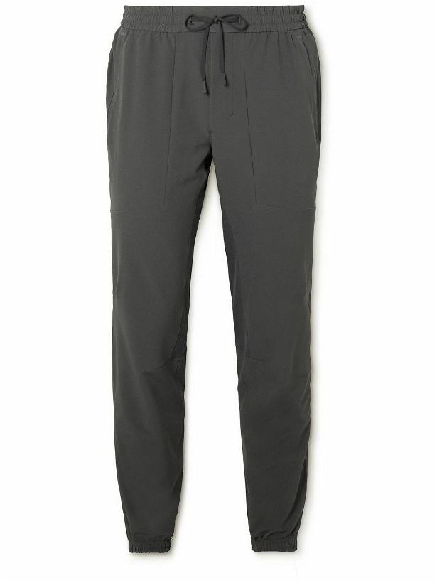 Photo: Lululemon - License to Train Tapered Stretch Recycled-Jersey Track Pants - Gray