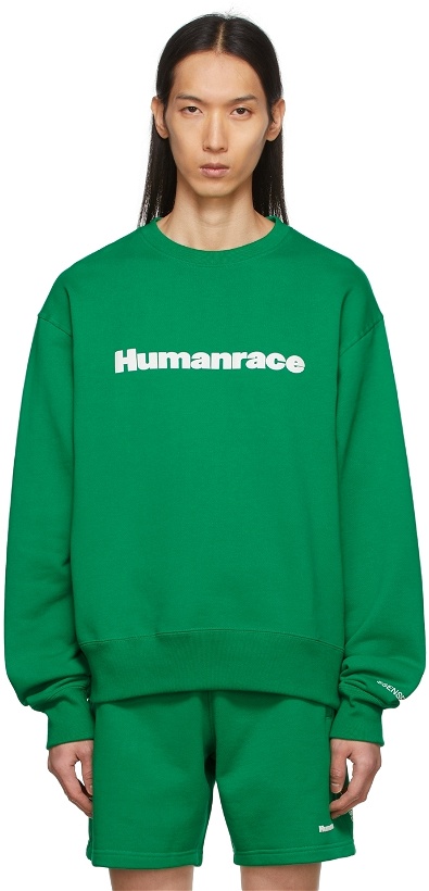 Photo: adidas x Humanrace by Pharrell Williams SSENSE Exclusive Green Humanrace Logo Sweatshirt
