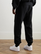 FEAR OF GOD ESSENTIALS - Straight-Leg Logo-Flocked Cotton-Blend Jersey Sweatpants - Black