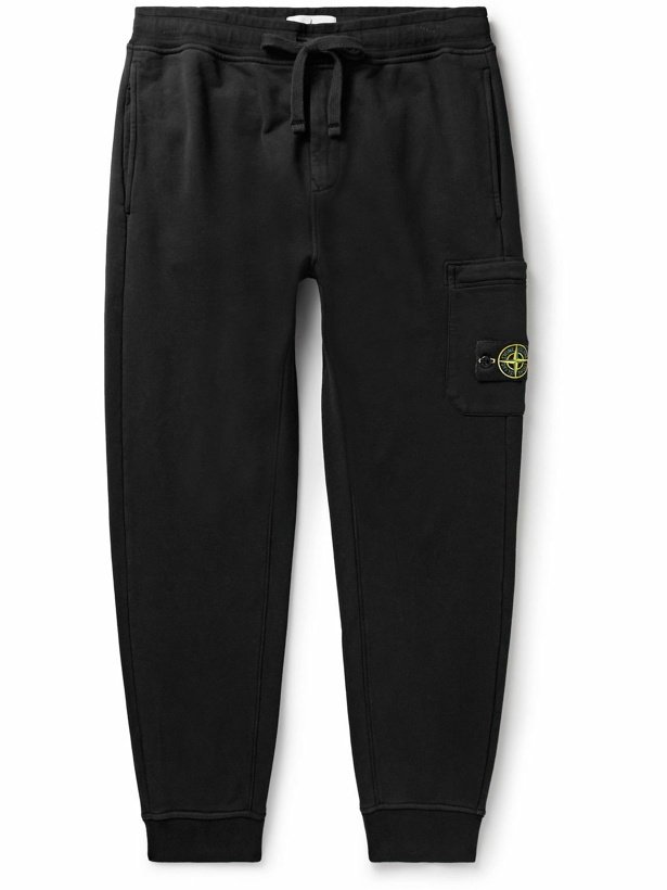Photo: Stone Island - Tapered Logo-Appliquéd Garment-Dyed Cotton-Jersey Sweatpants - Black