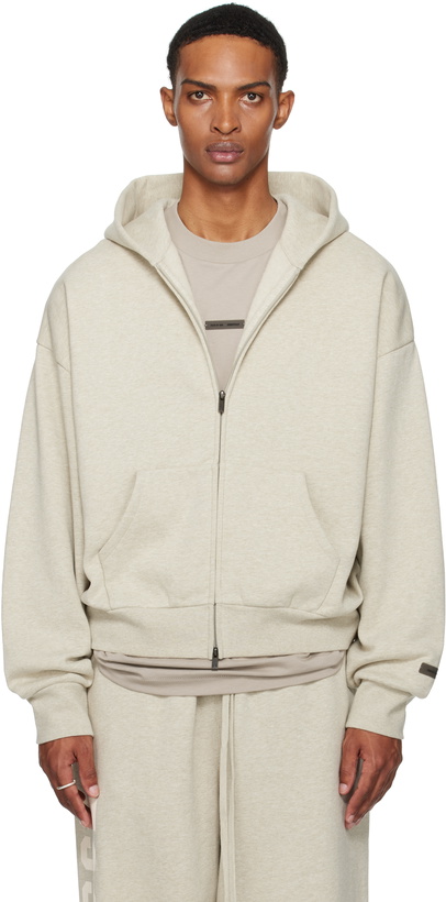 Photo: Fear of God ESSENTIALS Beige Classic Fit Fleece Zip-Up Hoodie