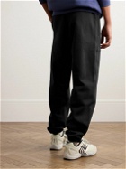 Nike - Solo Swoosh Tapered Logo-Embroidered Cotton-Blend Jersey Sweatpants - Black