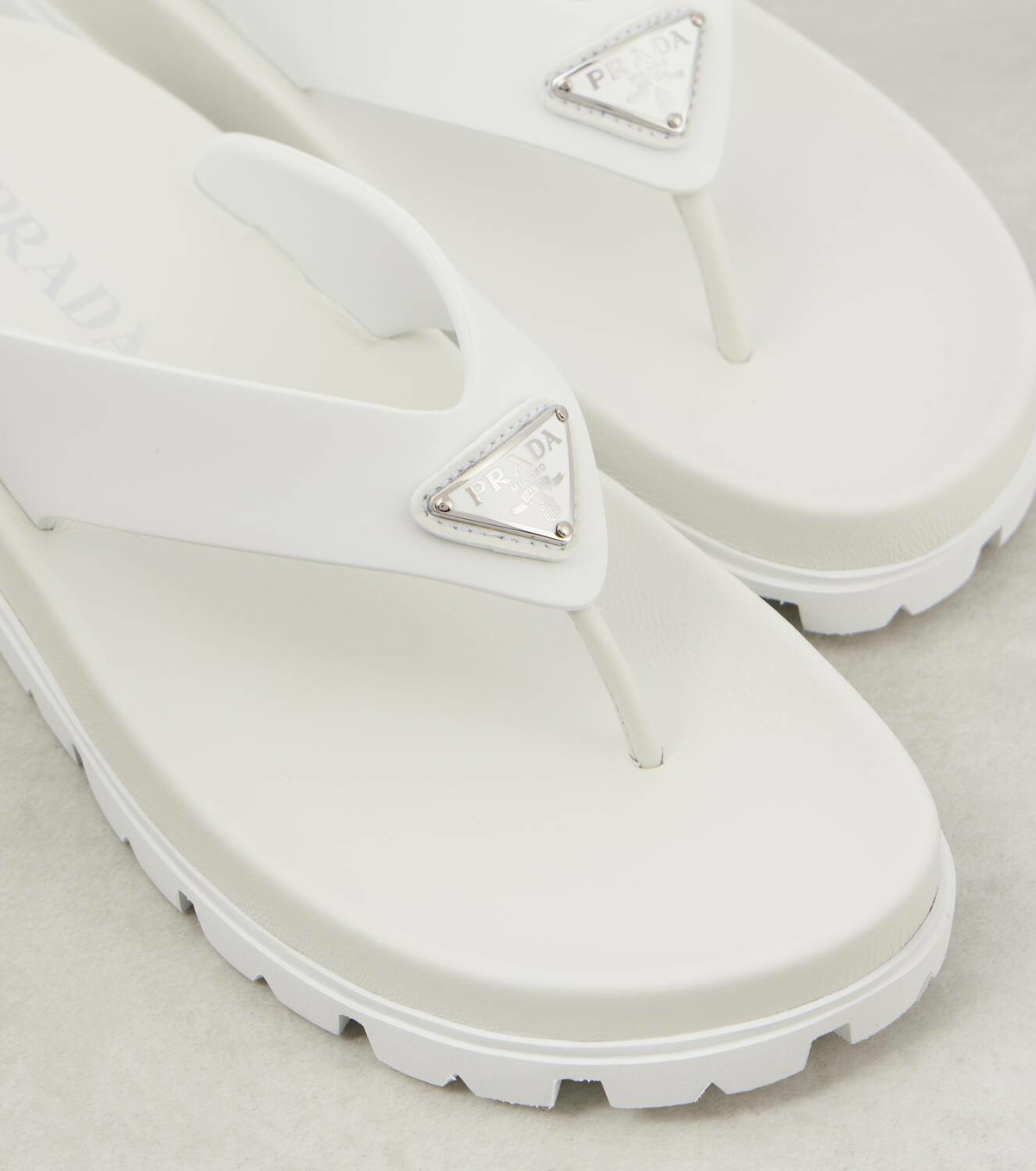 Prada Leather-trimmed thong sandals