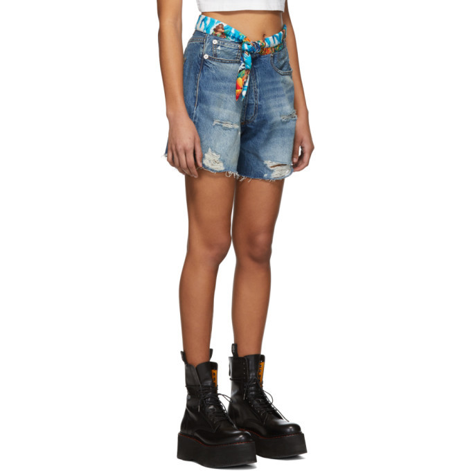 Crossover asymmetric distressed denim shorts