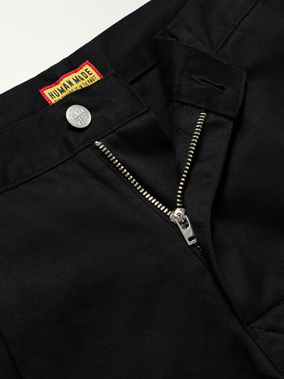 Human Made - Tapered Pleated Cotton-Canvas Trousers - Black