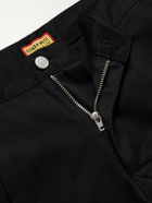 Human Made - Tapered Pleated Cotton-Canvas Trousers - Black