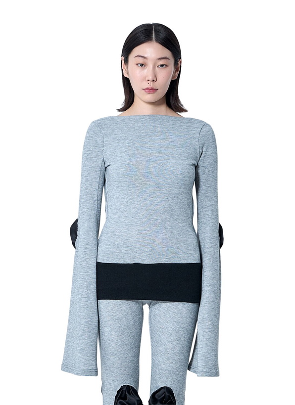 Photo: Sia Arnika Open-Rear Knit Top