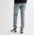 AMIRI - MX1 Skinny-Fit Panelled Distressed Stretch-Denim Jeans - Blue