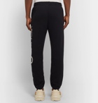 Gucci - Tapered Logo-Print Loopback Cotton-Jersey Sweatpants - Men - Black