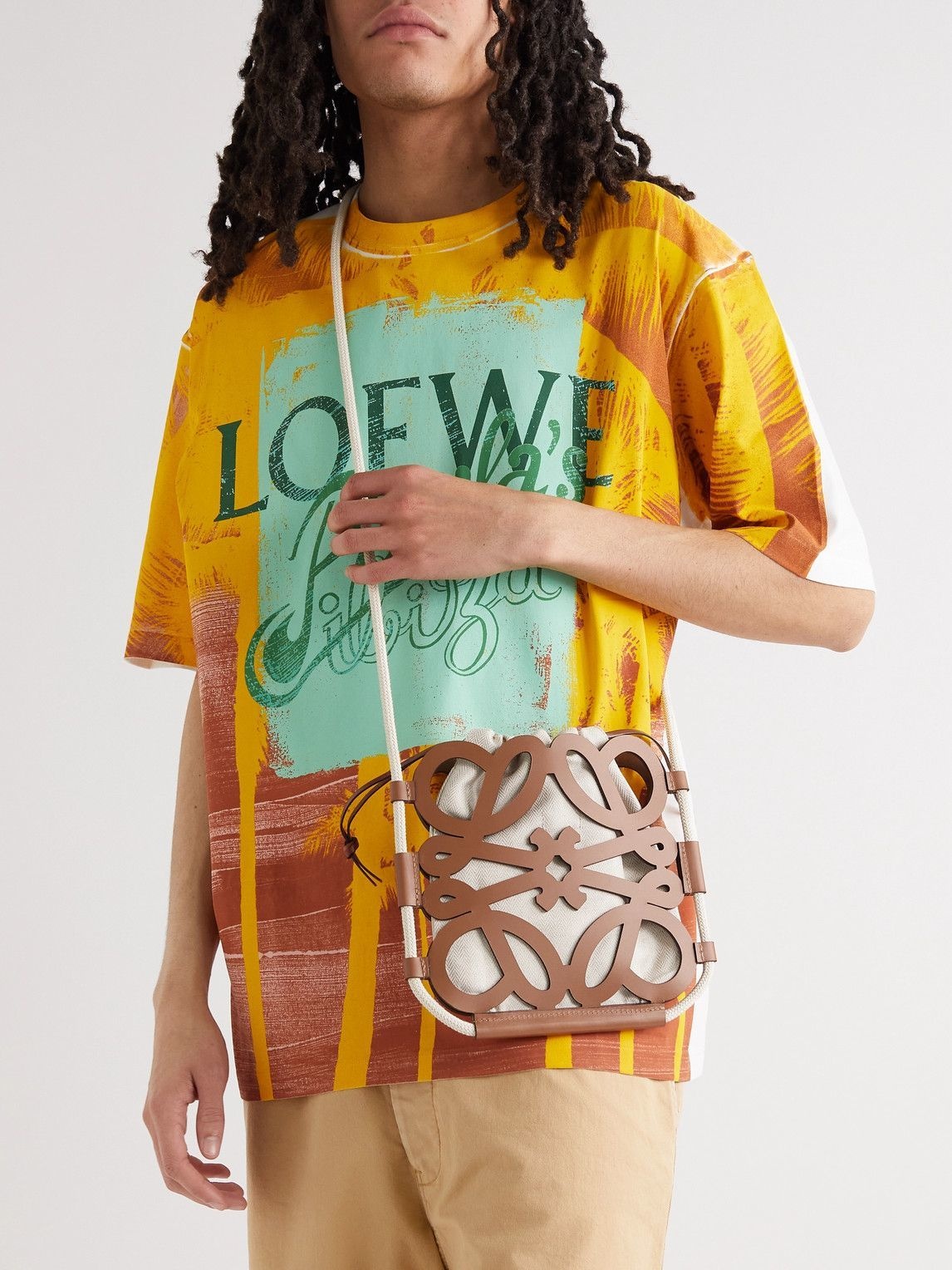 Anagram small cutout leather and cotton-canvas tote