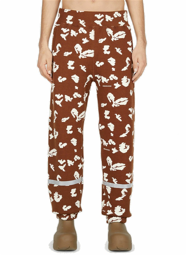 Photo: Undercover - Graphic Print Track Pants in Brown