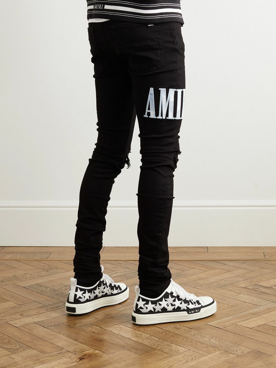 AMIRI - Skinny-Fit Logo-Appliquéd Panelled Distressed Jeans - Black Amiri