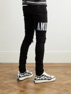 AMIRI - Skinny-Fit Logo-Appliquéd Panelled Distressed Jeans - Black