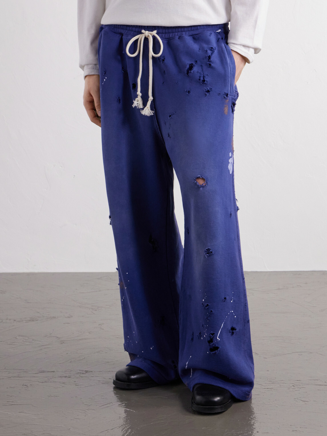 Satoshi Nakamoto - Luke Logo-Printed Paint-Splattered Distressed Cotton-Jersey Drawstring Sweatpants - Blue