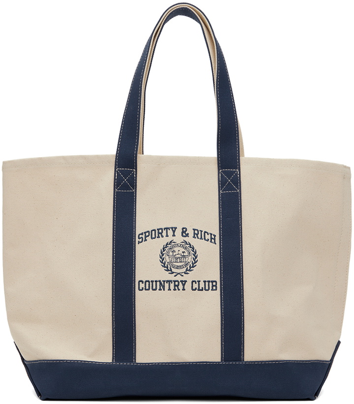 Photo: Sporty & Rich Off-White & Navy Varsity Crest Embroidered Two Tone Tote