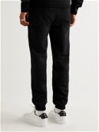 Givenchy - Tapered Printed Cotton-Jersey Sweatpants - Black