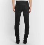 AMIRI - Skinny-Fit Distressed Waxed Stretch-Denim Jeans - Men - Black