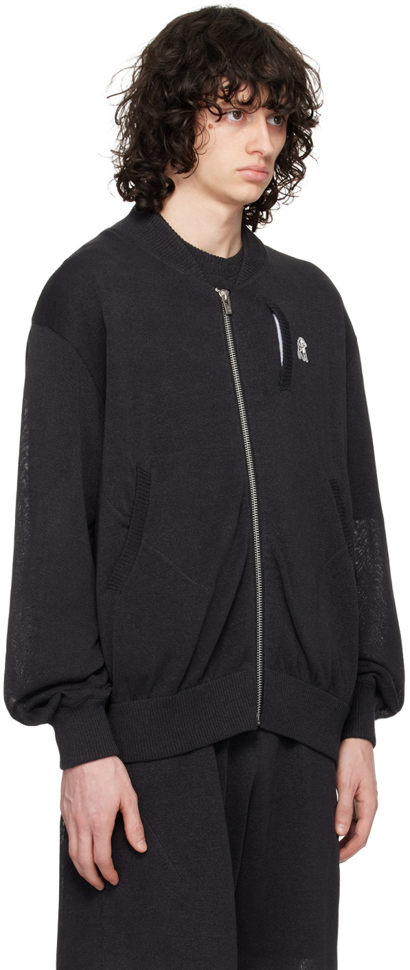 the Shepherd UNDERCOVER Black Appliqué Bomber Jacket