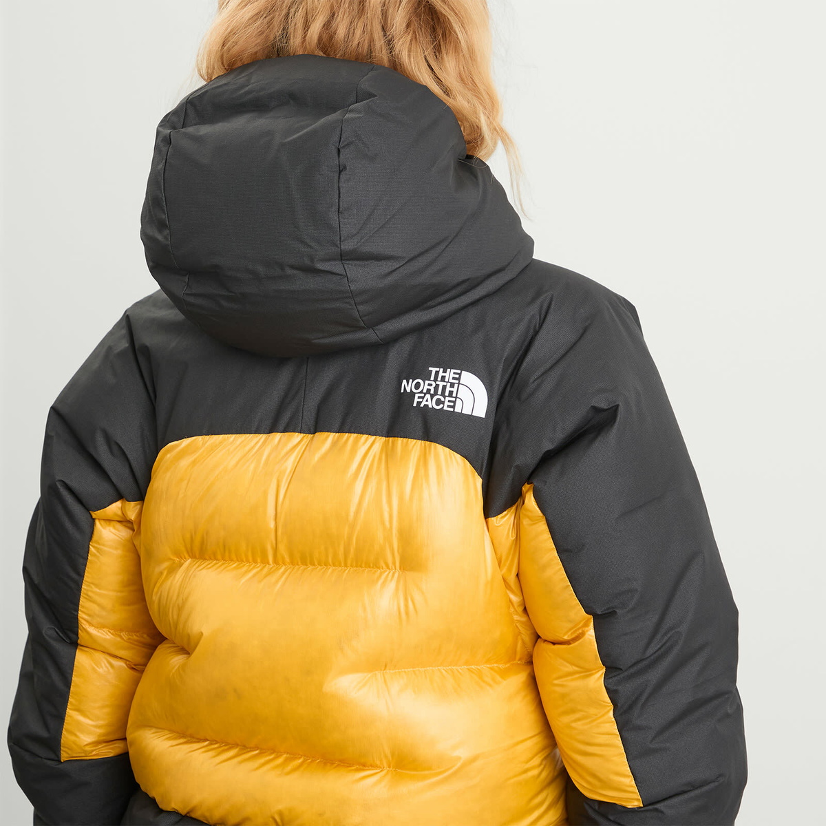 The North Face Women's Summit Himalayan Down Parka Jacket in Summit Gold/Tnf Black