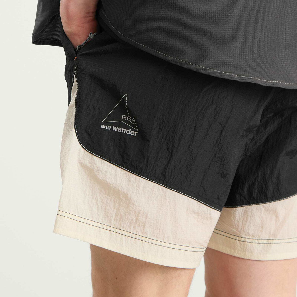 and wander Men's x ROA Ripstop Wind Shorts in Off White