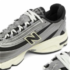 New Balance M1000SL Sneakers in Silver Metallic