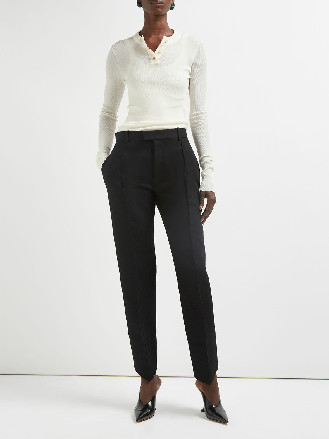 Bottega Veneta® Women's Curved Shape Wool Pants in Black. Shop