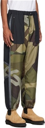 Sacai Green & Black KAWS Edition Camo Lounge Pants