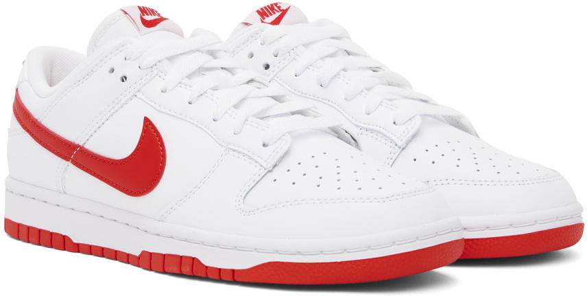 white nike sneakers with red swoosh
