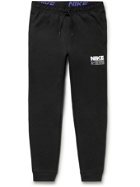 NIKE TRAINING - Tapered Logo-Print Dri-FIT Sweatpants - Black
