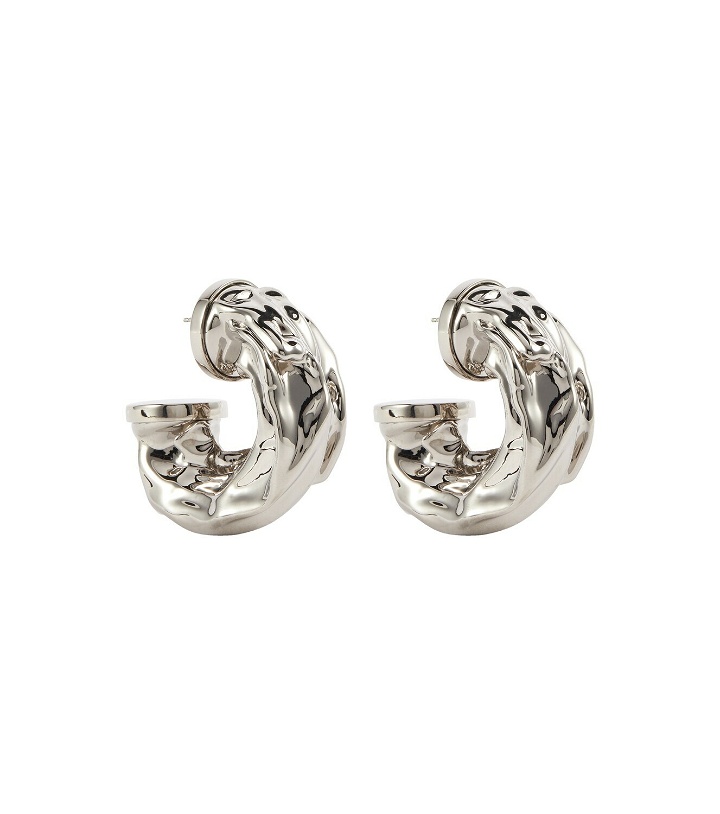 Photo: Courreges - Molten sculptural silver hoop earrings